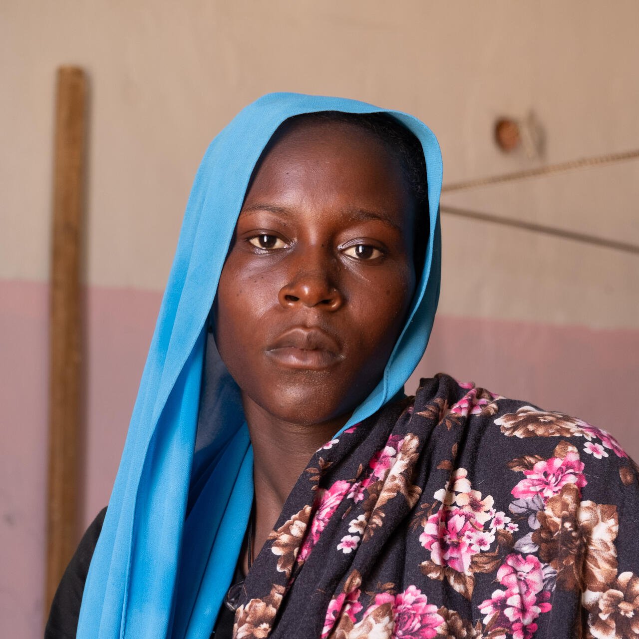 A women poses for a photo in a building in Chad.