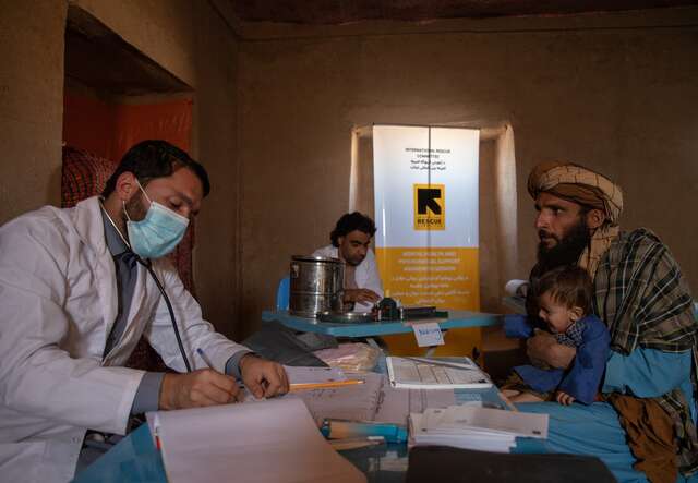 An IRC doctor treats a young boy at an IRC health center in Afghanistan.