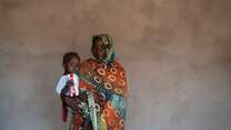 Khamissa, 70, holds her grandson, Djaba, after he was discharged from an IRC health clinic in Chad.